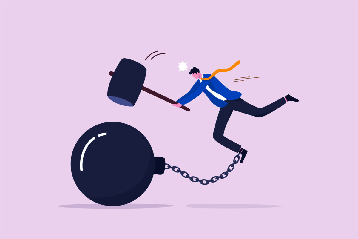illustration of a man hammering his ball and chain representing shame and addiction