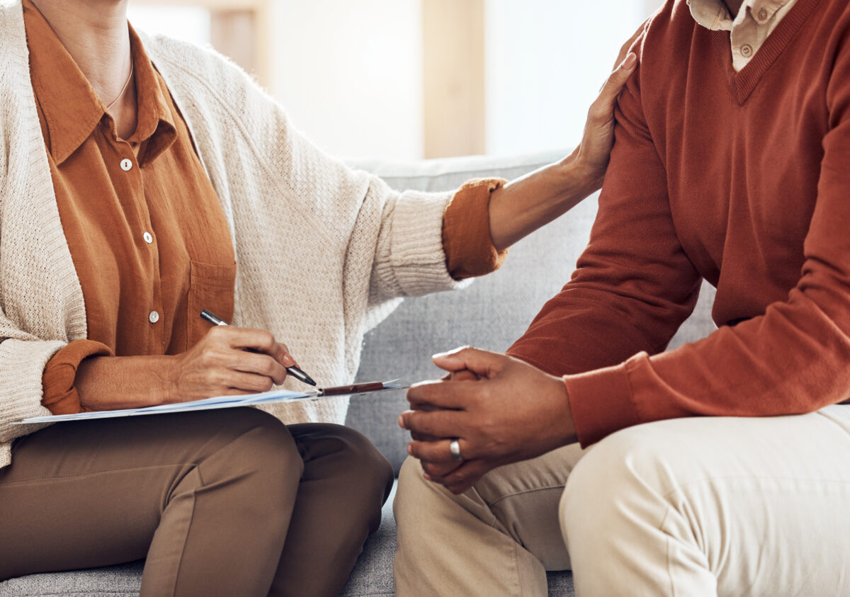 Therapist woman clipboard, man closeup and listen, question and support for mental health. Psychologist conversation with black man, consultation for healthy mind and deal with anxiety or depression.