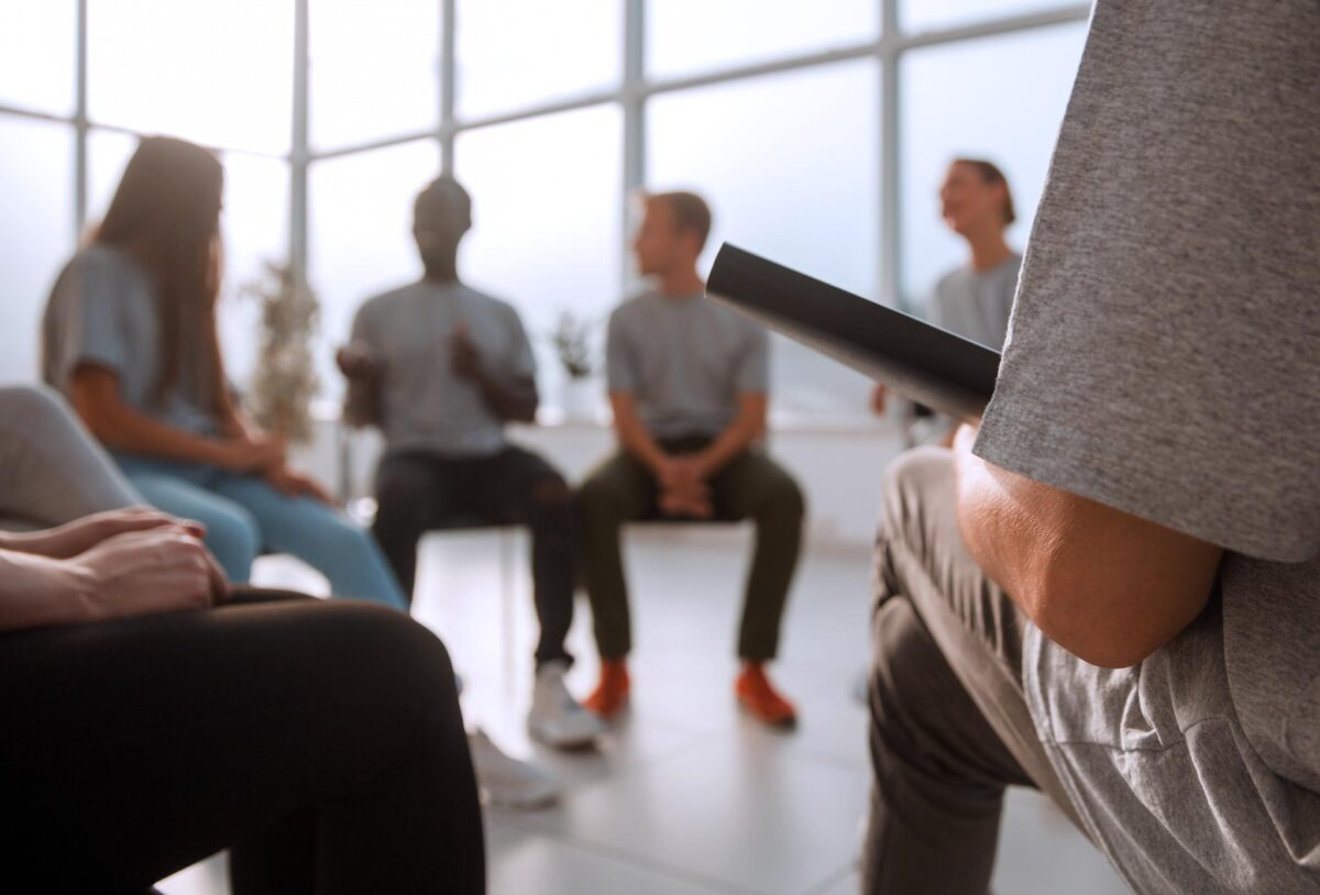 image of a group therapy session in mental health and addiction treatment