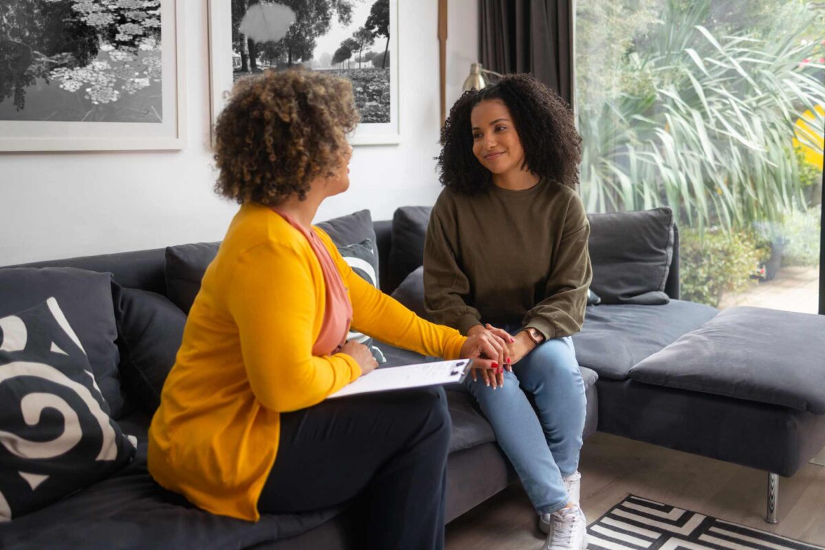 individual therapy session where client is smiling