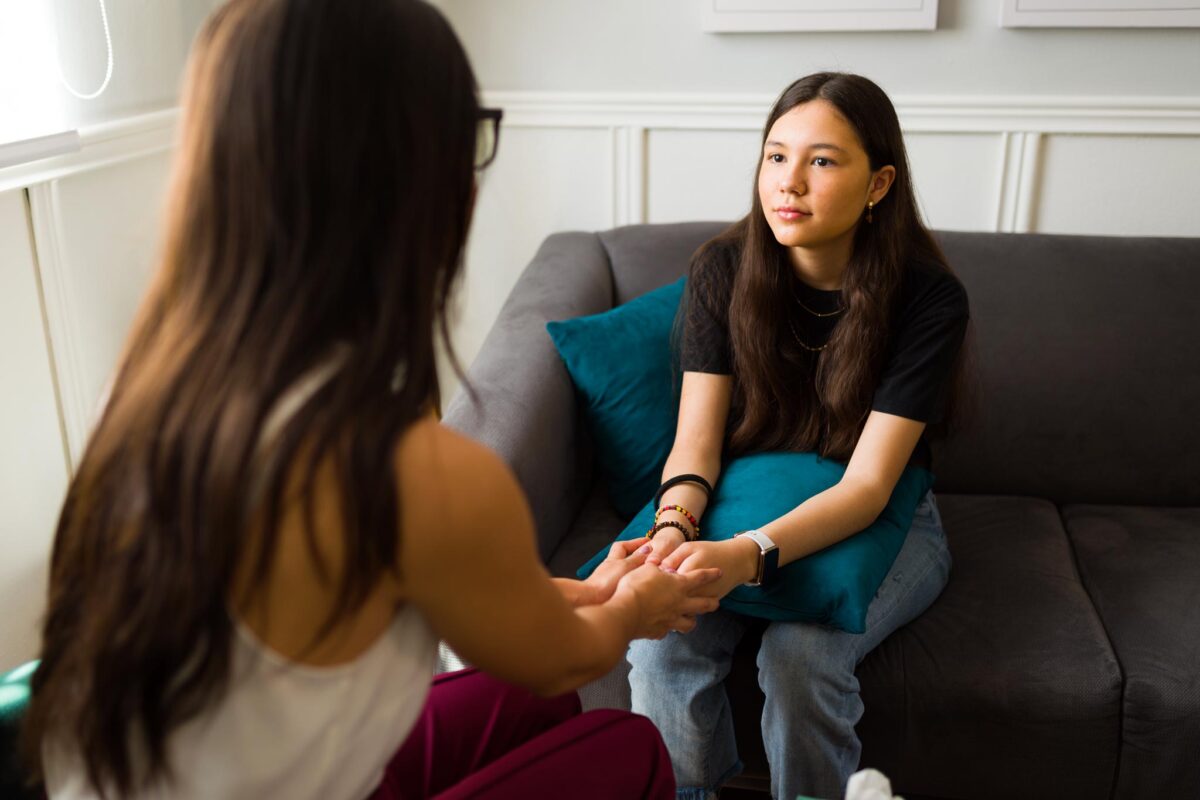 teen in therapy session receiving depression treatments